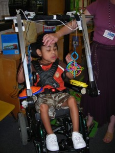Figure 1: Client using the Play Station device, mounted to his wheelchair