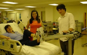 Figure 2: The occupational therapist demonstrates the device from a hospital bed.
