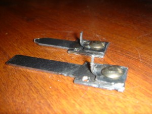 Figure 1. Custom tips for chisel (foreground) and nail set (background). The chisel tip is approximately 2” long