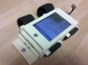 Figure 1a: The On Task Timer consists of an iPod Touch inside a custom case that attaches to the user’s arm and provides a vibration alarm