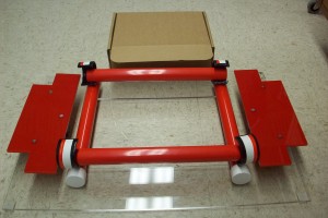 Figure 2: The box folding device, with a folded box in the background