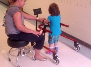 Figure 2: Client using the Hot Wheels device. The device is currently playing a “fireworks” video and a song as the client is walking.