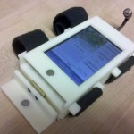Figure 1a: The On Task Timer consists of an iPod Touch inside a custom case that attaches to the user’s arm and provides a vibration alarm
