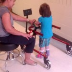 Figure 2: Client using the Hot Wheels device. The device is currently playing a “fireworks” video and a song as the client is walking.